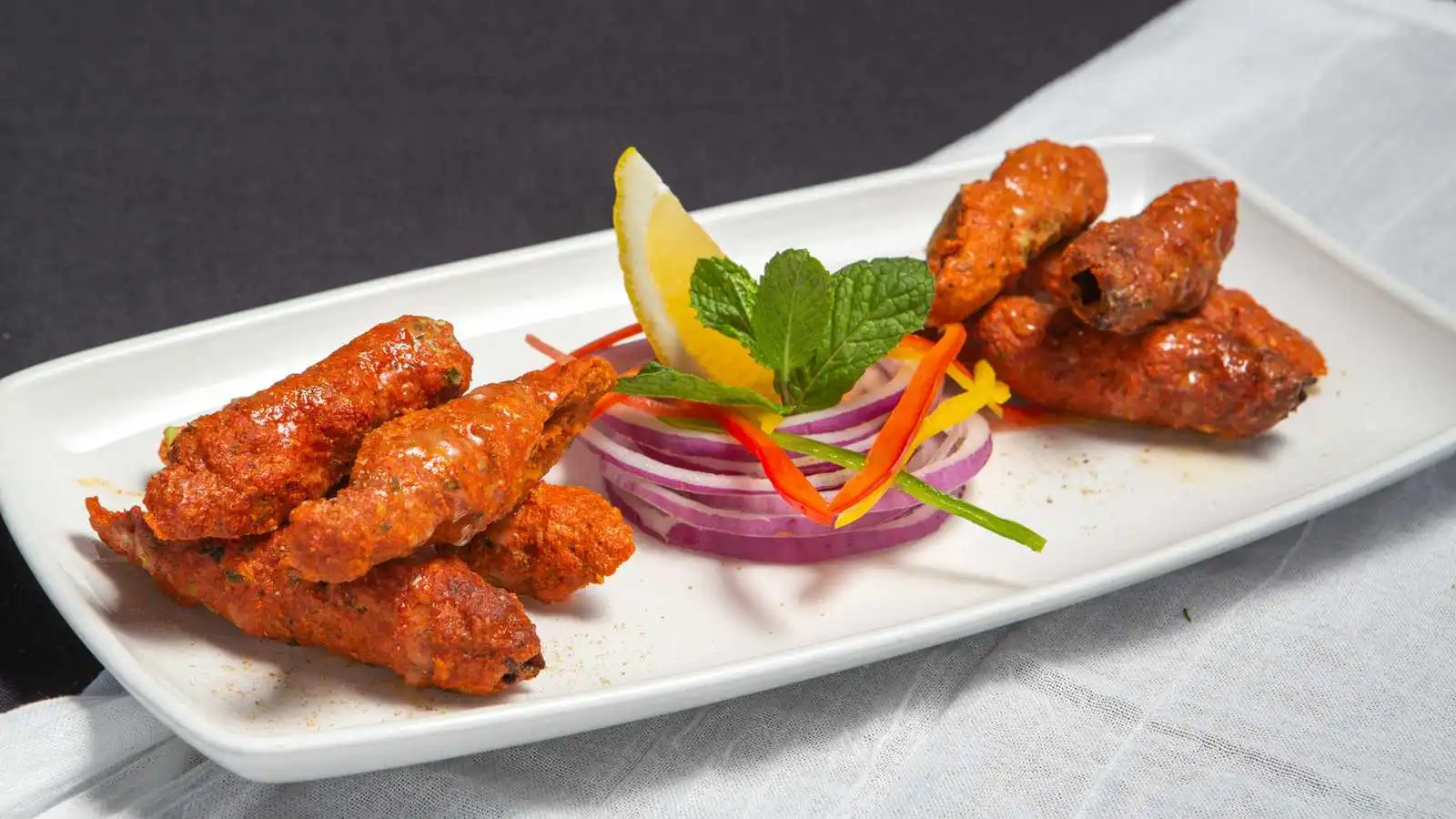 Lamb Seekh Kebab at Indian Accent Kitchen and Bar in Calgary, AB